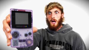Logan Paul holding a GameBoy Color.